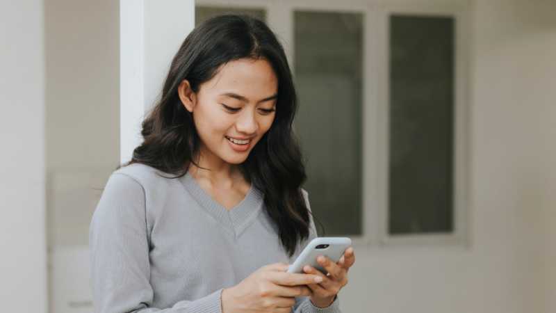 Woman recording qual video on phone